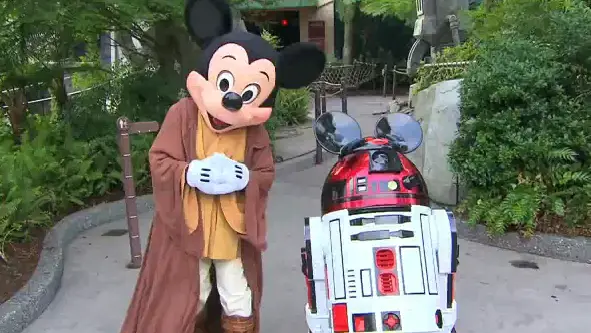 Jedi Master Mickey Mouse and R2-MK outside the Star Tours