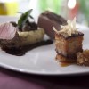 Pork two ways wood fire tenderloin w goat chesse polenta braised lacquered belly and country applesauce 640x426