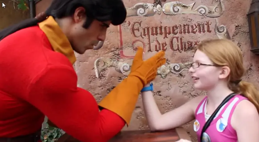 Girl challenges Gaston to arm wrestle match and wins!