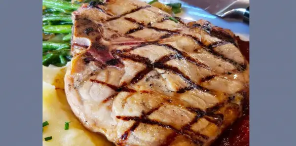Chef Art Smith's Homecomin' Introduces a Porterhouse Pork Chop to the Menu