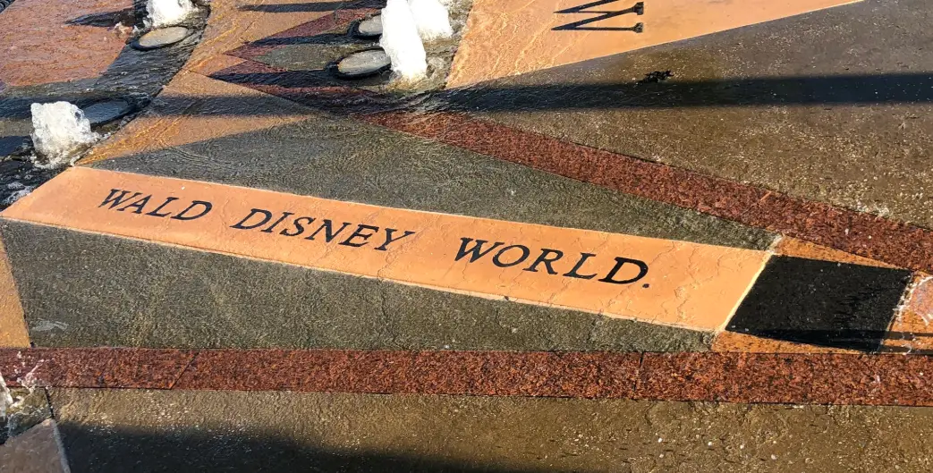 Walt Disney World misspelled on a fountain in Celebration