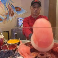 Santa Hat Cotton Candy Comes to Epcot Just in Time for the Ho Ho Holidays