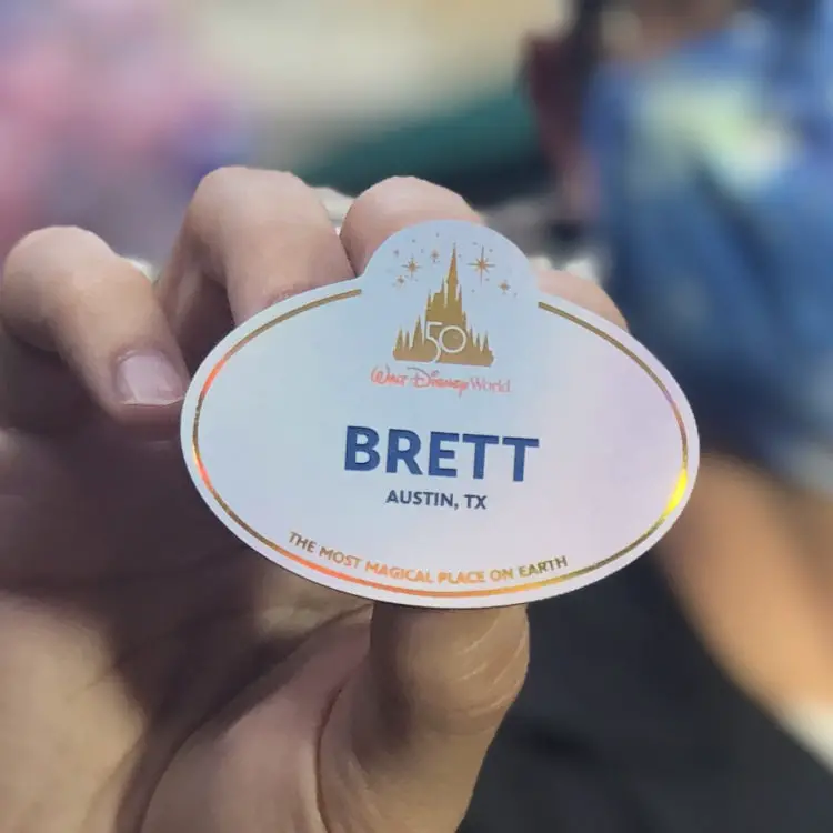 Cast Members receiving new name tags for Disney World's 50th Anniversary Celebration