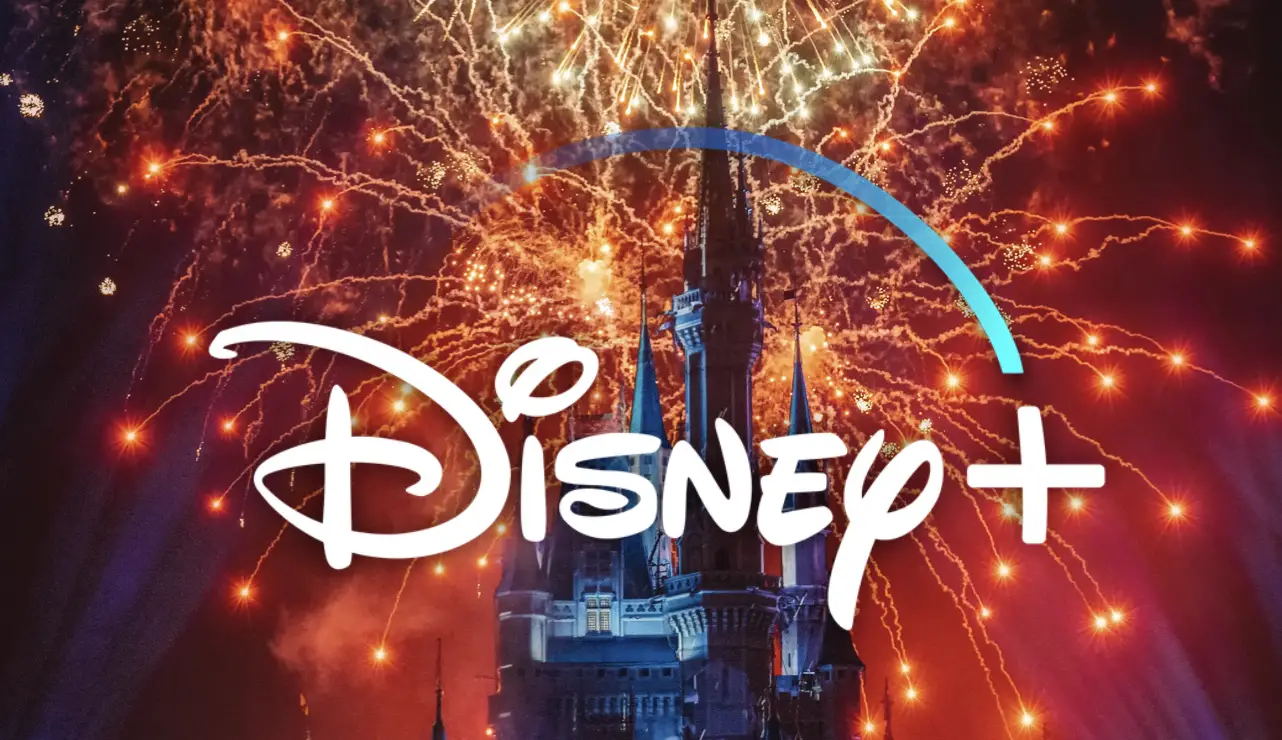 Disney+ Logo with Cinderella's Castle  at night with fireworks in the background