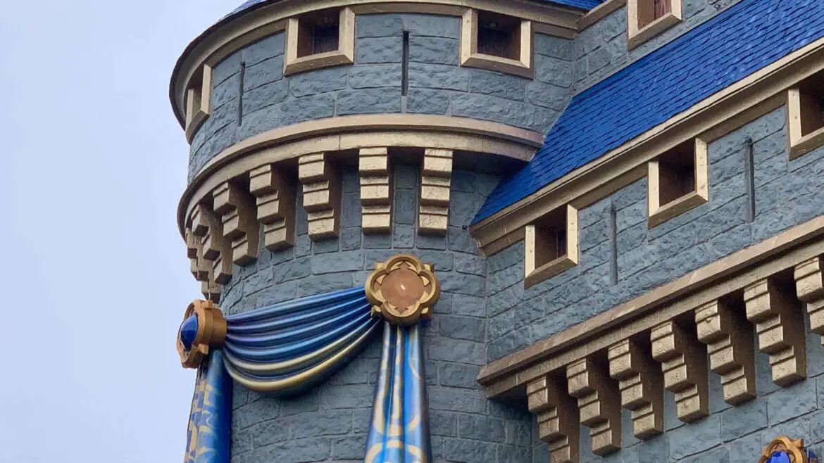 One of the 50th anniversary Cinderella Castle decorations fall off