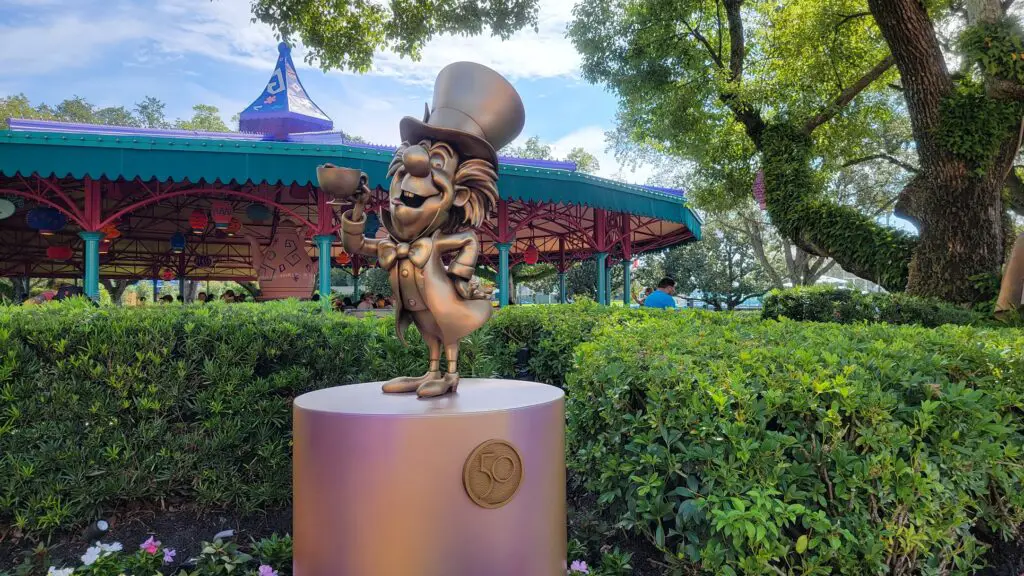 Cheshire Cat & Mad Hatter Disney Fab 50 statues pop up at the Magic Kingdom