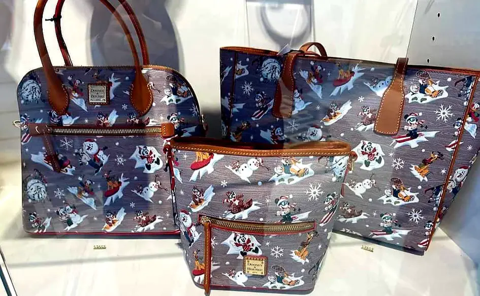The New Disney Holiday Dooney And Bourke Collection is A Winter Wonderland Of Style