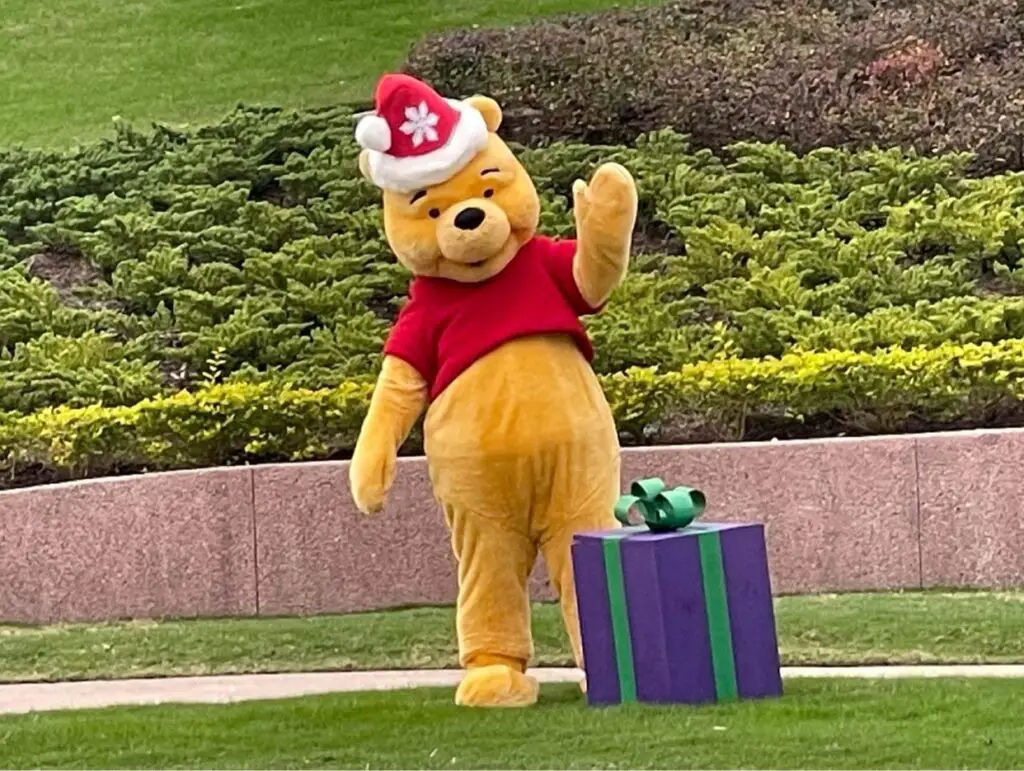 Joy & Pooh in Holiday attire out greeting guests in Epcot