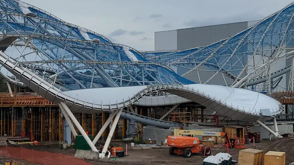 Tron Lightcycle Run Construction shows crews working on the entrance and roof