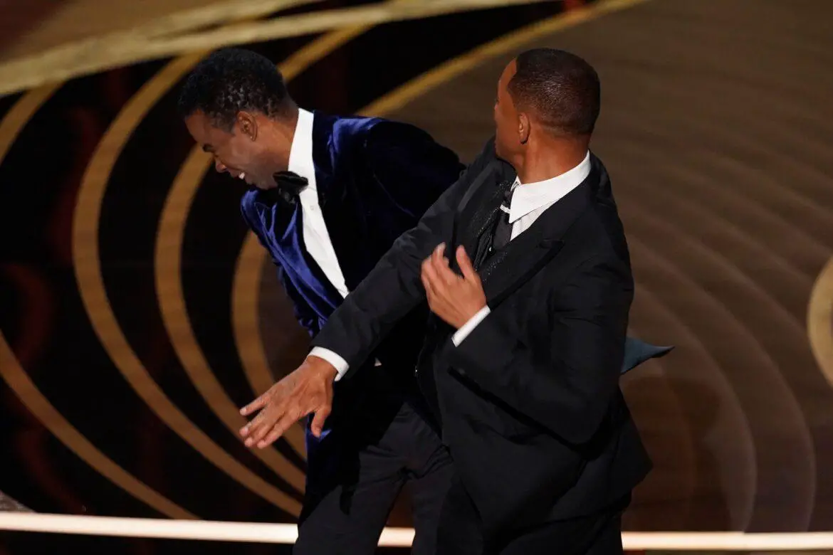 Will Smith smacks Chris Rock for making fun of his wife at the Oscars