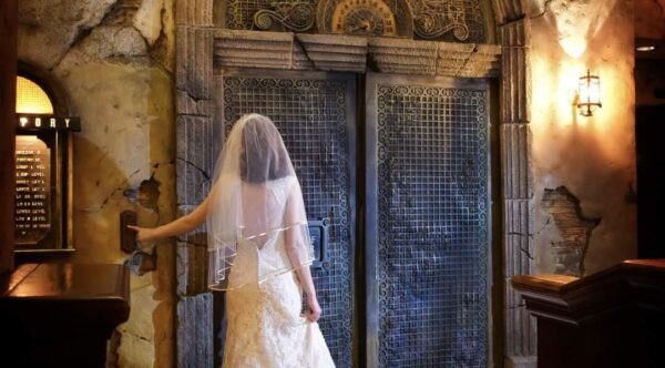 Bride pushes button at Tower of Terror elevator