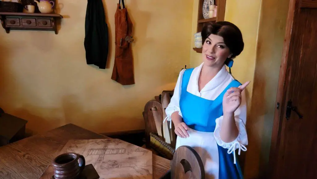 Belle greeting guests at Enchanted Tales in the Magic Kingdom