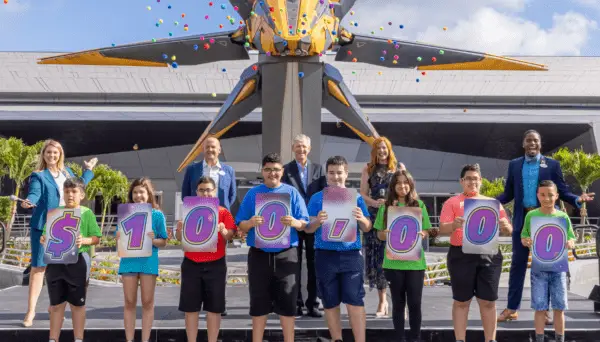 Students from the Boys and Girls Club of Central Florida gather in front of Guardians of the Galaxy: Cosmic Rewind in EPCOT