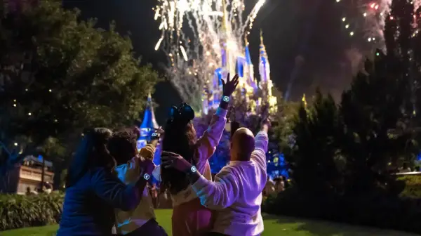 Guests enjoy a fireworks display with new MagicBand+ features