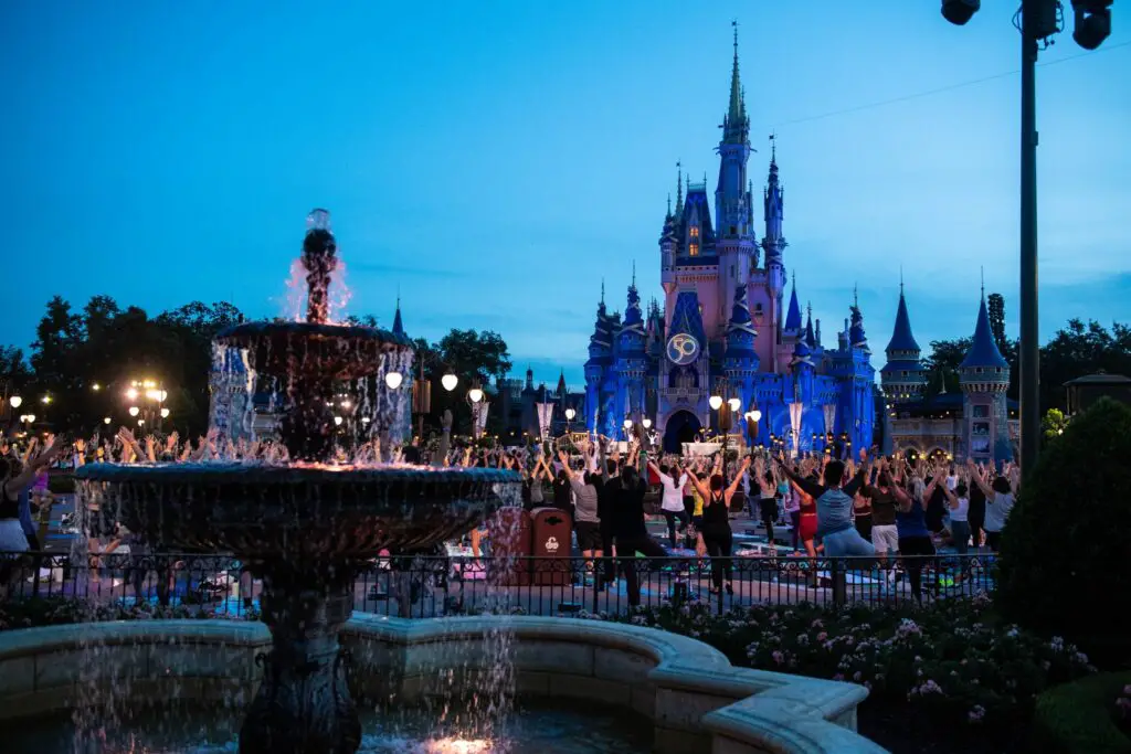 Nearly 2000 Disney Cast Members participate in Sunrise Yoga at the Magic Kingdom