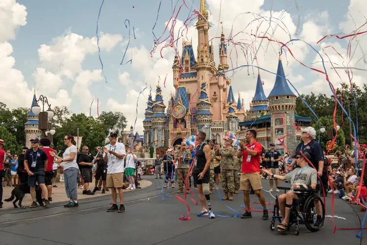Video: Warrior Games Athletes Participate in Torch Parade and Flag Retreat Ceremony at Magic Kingdom