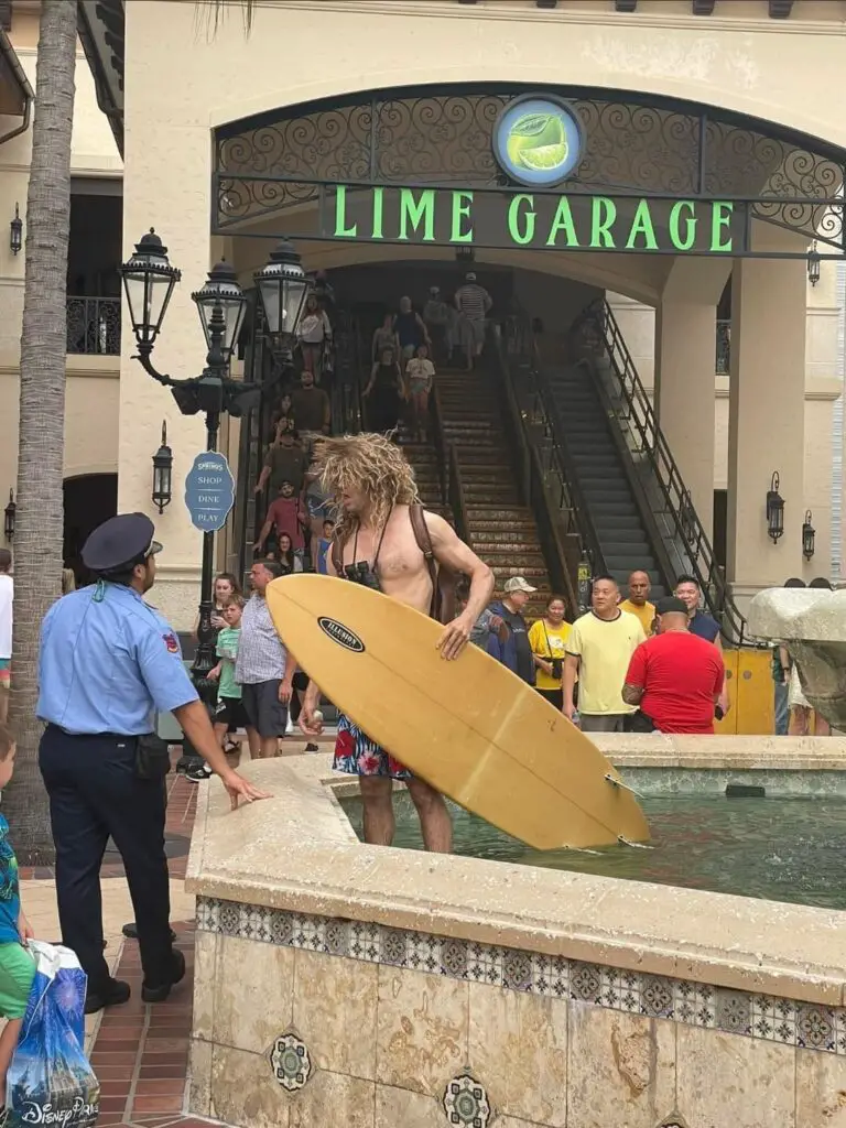 Man attempts to go surfing in Water Fountain at Disney Springs