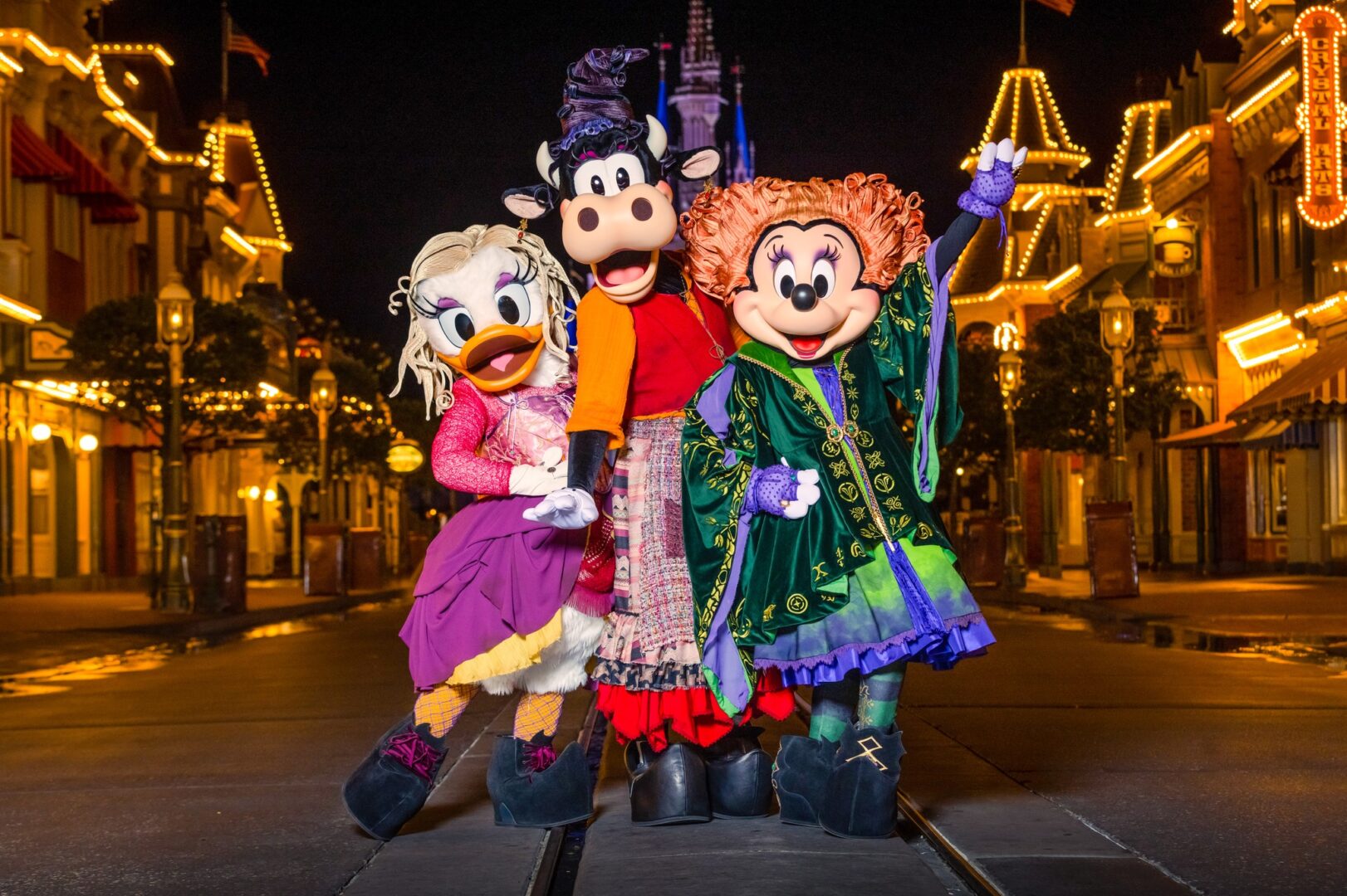 Minnie, Daisy, and Clarabelle dressed as the Sanderson Sisters in Mickey’s “Boo-To-You” Parade