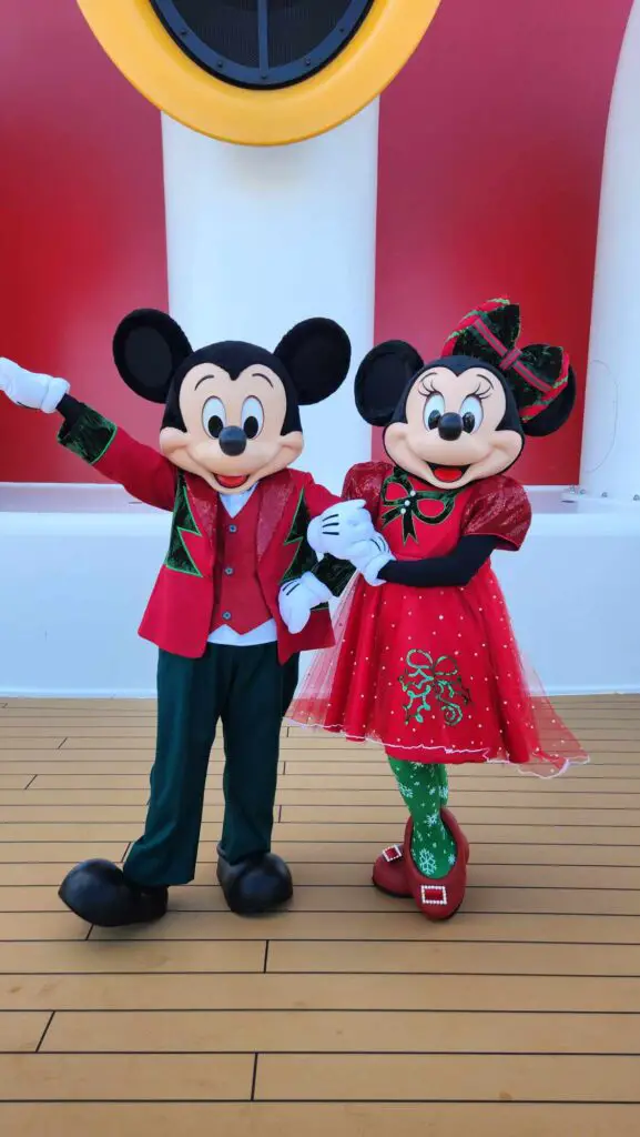 Mickey-Friends-Meeting-Guests-in-Holiday-Outfits-Onboard-Disney-Cruise-Line-Very-Merrytime-Voyages