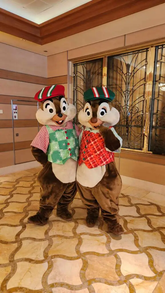 Mickey-Friends-Meeting-Guests-in-Holiday-Outfits-Onboard-Disney-Cruise-Line-Very-Merrytime-Voyages-chip-and-dale
