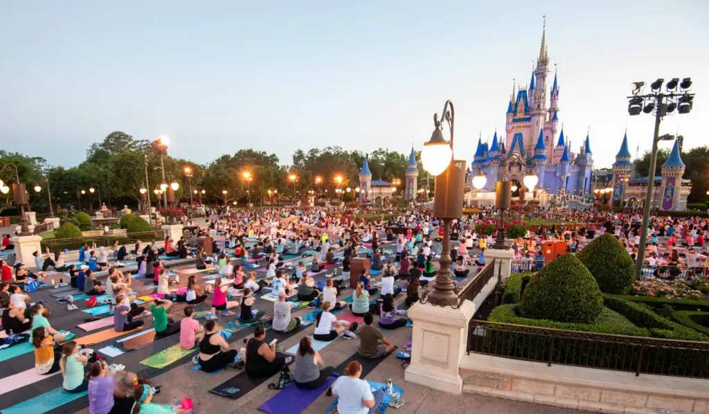 Disney-World-Cast-Members-Celebrate-International-Yoga-Day-in-front-of-Cinderella-Castle