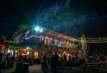 Nightly snow flurries over the main building at Wekiva Island Winter Wonderland