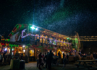 Nightly snow flurries over the main building at Wekiva Island Winter Wonderland